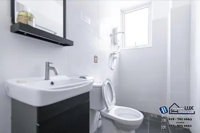 a white bathroom with a sink and a toilet at 20BR SwimmingPool Villa Golf View Snooker BBQ in Bayan Lepas
