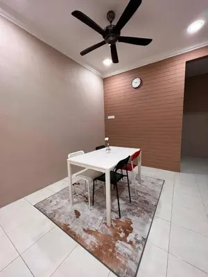 a dining room with a table and a ceiling fan at Rumah 127 - Homestay Taiping in Simpang