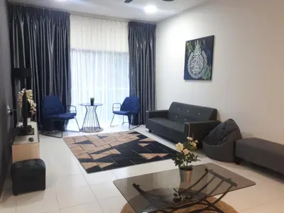 a living room with a couch and a table at Adsyahrizmal Homestay d'Cameron in Tanah Rata