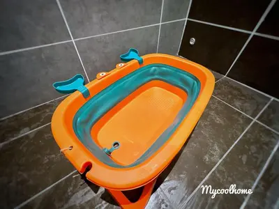 an orange and blue bath tub sitting on a tiled floor at Sunway Onsen Hotsprings with Ipoh City View, Sunway Lost World in Ipoh