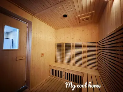 a sauna with a window in a wooden room at Sunway Onsen Hotsprings with Ipoh City View, Sunway Lost World in Ipoh