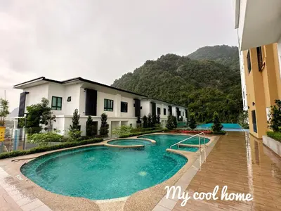 a swimming pool in front of a building at Sunway Onsen Hotsprings with Ipoh City View, Sunway Lost World in Ipoh