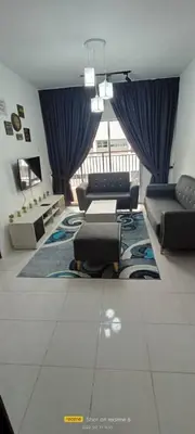 a living room with a couch and a table at Amy Homestay in Brinchang