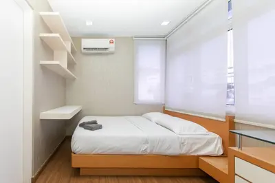 a small bedroom with a bed and a window at GeorgeTown PrivatePool Snooker 25Pax BBQ in George Town