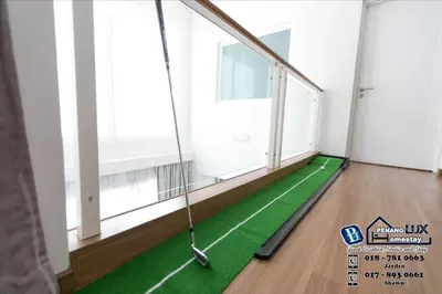 an empty room with a golf ball on a green floor at GeorgeTown PrivatePool Snooker 25Pax BBQ in George Town