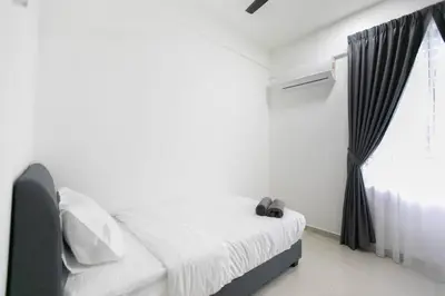 a white bedroom with a bed and a window at Newly Renovated 3Bedroom Vacation Home 6-8pax in Bayan Lepas