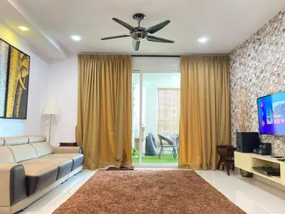 a living room with a couch and a ceiling fan at Lovely Cozy studio 3pax@mansion one Gurney in George Town