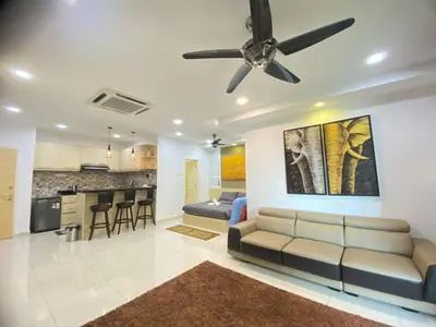 a living room with a couch and a ceiling fan at Lovely Cozy studio 3pax@mansion one Gurney in George Town
