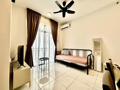 a living room with a bed and a ceiling fan at 13A5TheSun#BayanLepas#QueensbayMall#CozyHomestay in Bayan Lepas