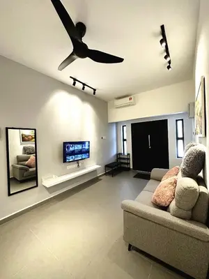 a living room with a couch and a ceiling fan at PM153 LandedHouse Modern Airport in Bayan Lepas