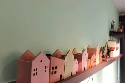 a shelf with a model of a city on it at Emerald Avenue Cozy 3R3B Apartment 716 in Brinchang