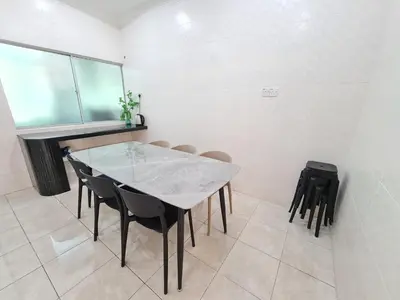 a dining room with a table and chairs at Air-home M3 Simpang near Aulong Econsave, 4BR, 10pax, Netflix in Taiping