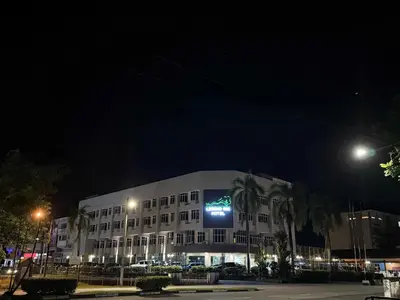 a building with a sign on it at night at Legend Inn Taiping in Taiping