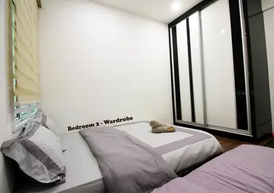 a bedroom with two beds and a large window at H2H - Cherry house Majestic in Ipoh