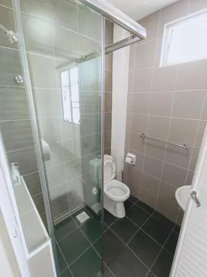 a bathroom with a toilet and a glass shower at Yarra Park, Up to 10 Pax, 5 Bedrooms, 4 Bathrooms, 2 Car Parks by Star Home in Sungai Petani