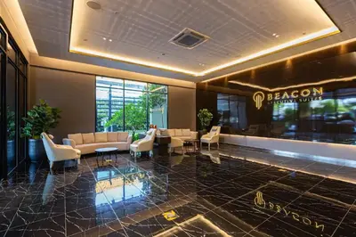 a lobby of a hotel with couches and chairs at Rooftop Pool, Up to 8 Pax, 2 Bedrooms, 2 Bathrooms, 2 Car Parks by Star Home in George Town