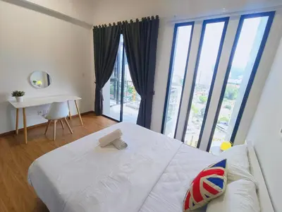 a bedroom with a white bed and a large window at Rooftop Pool, Up to 8 Pax, 2 Bedrooms, 2 Bathrooms, 2 Car Parks by Star Home in George Town