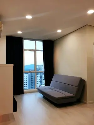 a bedroom with a bed in front of a large window at Charming Studio 1BR 1LR Condo Georgetown \u9b45\u529b\u4e00\u5ba4\u4e00\u5385\u5957\u623f in George Town