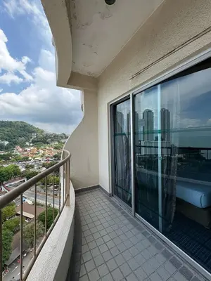 a balcony of a building with a view of a city at Rainbow deluxe seaview in Tanjung Bungah