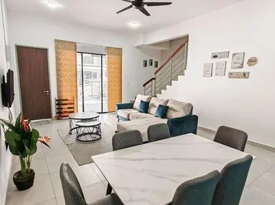 a living room with a table and a couch at W17WarmStay@GoldenHills in Brinchang