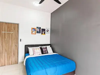 a bedroom with a blue bed and a wooden door at W17WarmStay@GoldenHills in Brinchang
