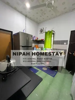a nipah homogeneity sign in a room at Nipah Homestay Parit Buntar in Parit Buntar
