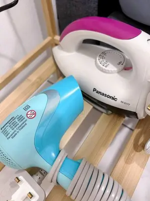 a hair dryer and a toaster sitting on a shelf at TheSun #Studio #BayanLepas #Pisa in Kampong Manggis