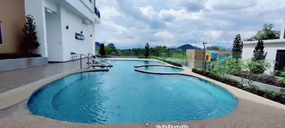 a swimming pool in the middle of a building at H&W Sunway Onsen Suites Services Tambun Ipoh S-07-05 in Ipoh