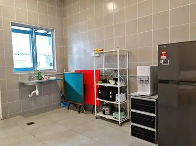 a kitchen with a sink and a refrigerator at W45WarmStay@GoldenHillsNightMarket in Brinchang