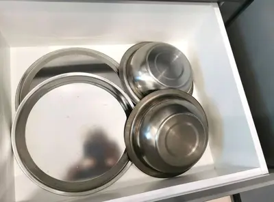 two metal pots sitting on a shelf in a drawer at Paradise Home- 10Pax/4CarPark- Pg Bridge/KPJ Hosp in Bukit Mertajam