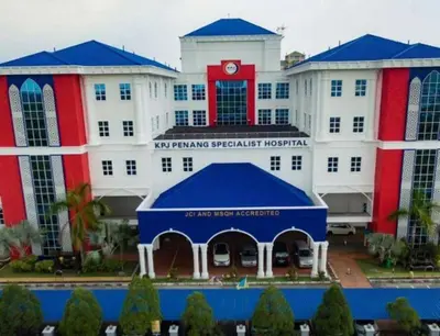 a large white building with a blue tent in front of it at Paradise Home- 10Pax/4CarPark- Pg Bridge/KPJ Hosp in Bukit Mertajam