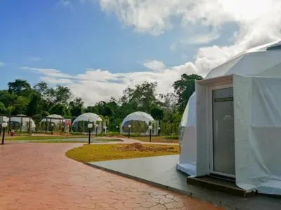 a domed building with a door in a park at The Dome @ Gua Musang in Gua Musang