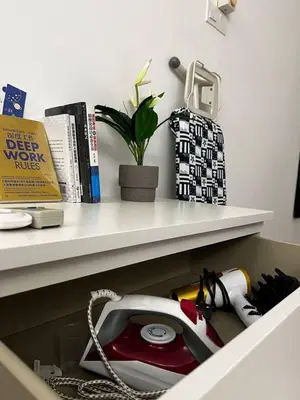 a phone sitting on a shelf in a drawer at Ipoh Cozy Modern Suite 6-7pax @ Adson's Home in Ipoh