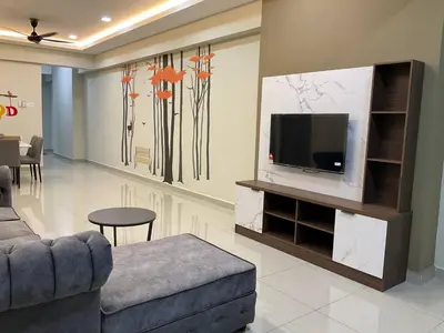 a living room with a tv on a entertainment center at Sweet Homestay The Venus Sitiawan \u6e29\u99a8\u6c11\u5bbf in Sitiawan
