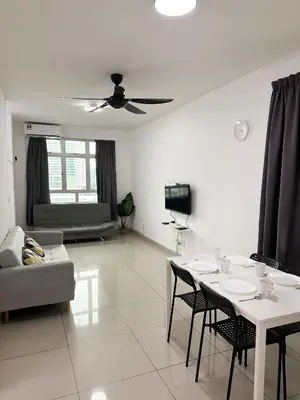 a white living room with a table and a couch at TuR10-Oppesite Pisa Stadium-1min-FoodCourt-MiniMarket in Bayan Lepas