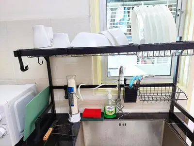 a kitchen sink with a shelf above it at TuR10-Oppesite Pisa Stadium-1min-FoodCourt-MiniMarket in Bayan Lepas