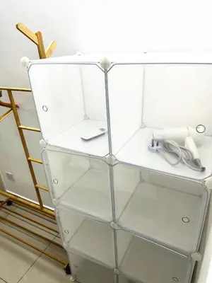 a glass shelf with a pair of scissors at TuR10-Oppesite Pisa Stadium-1min-FoodCourt-MiniMarket in Bayan Lepas
