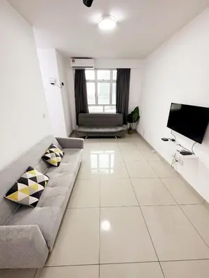 a living room with a couch and a flat screen tv at TuR10-Oppesite Pisa Stadium-1min-FoodCourt-MiniMarket in Bayan Lepas