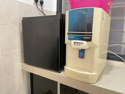 a pay phone sitting on a shelf in a bathroom at Cozy 119 Homestay Teluk Intan in Teluk Intan