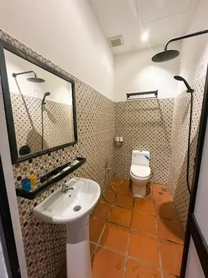 a bathroom with a sink and a toilet at The Century Aigoh Hotel in George Town