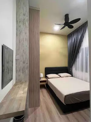a bedroom with a bed and a ceiling fan at Lucky Home @ Quintet Tanah Rata in Cameron Highlands