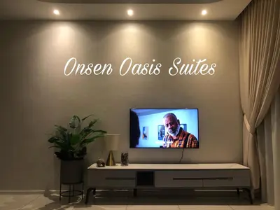 a flat screen tv sitting on top of a table at Onsen Oasis Premium Suites in Tambun