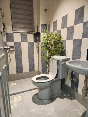 a bathroom with a toilet and a sink at Galaxy Guest Home by Ipoh Maju Stay in Ipoh