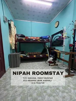 a room with two bunk beds and a sign that reads nirvana roomeway at NIPAH ROOMSTAY PARIT BUNTAR in Parit Buntar