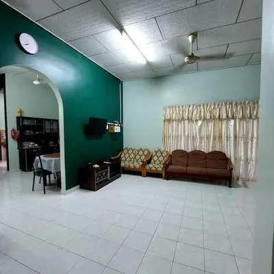 a living room with a couch and a table at Adam Homestay in Ipoh