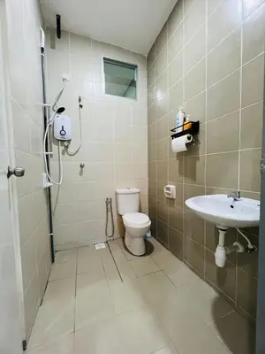 a bathroom with a shower and a toilet and a sink at SRS WIN Homestay in Sungai Petani