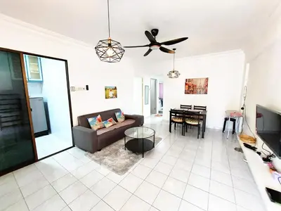 a living room with a couch and a table at EC12-Georgetown-3room-PrivateHouse in Jelutong