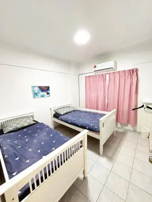 a bedroom with two beds and a window at EC12-Georgetown-3room-PrivateHouse in Jelutong