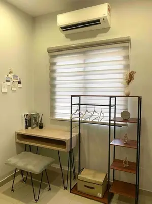 a room with a window with a desk and a fan at Stylish Cozy House Near Ipoh Lost World Tambun in Kampong Batu Lapan