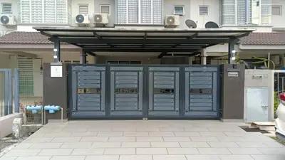 a blue gate with speakers on top of a house at Stylish Cozy House Near Ipoh Lost World Tambun in Kampong Batu Lapan